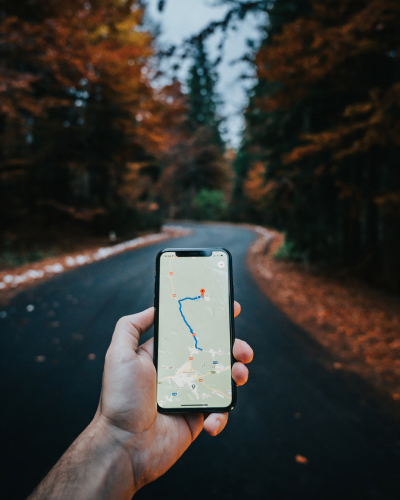 Mobile showing map ready to give directions on forest road