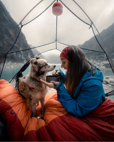 Woman and dog camping